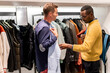 © Hernandez & Sorokina/Stocksy - Man Shopping With Stylist