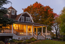 Exterior Of Craftsman Home With Maple Tree Foliage 