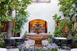 © Trinette Reed/Stocksy - Courtyard in hotel