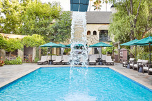 Water Fountain In Pool At Luxury Hotel
