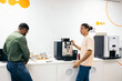 © Pedro Merino/Stocksy - Coworkers taking a coffee break in a coworking