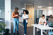 © Pedro Merino/Stocksy - Business women working in a coworking space.