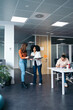 © Pedro Merino/Stocksy - Business women working in a coworking space.