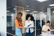 © Pedro Merino/Stocksy - Business women working in a coworking space.