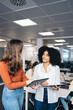 © Pedro Merino/Stocksy - Business women working in a coworking space.