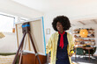 © Raymond Forbes LLC/Stocksy - African American Lifestyle Girl artist Painting easel with scarf