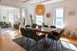 © Raymond Forbes LLC/Stocksy - Dining room with style in contemporary home with laptop computer