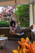 © Raymond Forbes LLC/Stocksy - African American Lifestyle Girl relaxing at home with wireless tablet