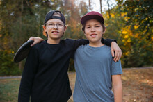 Two friends - brothers - enjoying disc golf together.