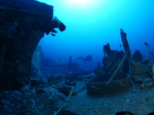 Wreck Underwater In Blue Water Scuba Divers To Explore Metal On Ocean