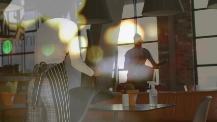Poster - Animation of light spots over diverse waiters with face masks holding chairs
