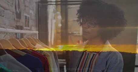 Poster - Animation of landscape over african american female designer