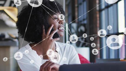 Poster - Animation of network of connections over african american businesswoman talking on smartphone