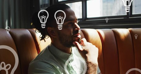 Poster - Animation of lightbulb icons over biracial businessman thinking