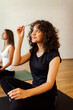 © Valentina Barreto/Stocksy - Women during yoga class in studio