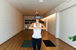 © Valentina Barreto/Stocksy - Woman practicing yoga with virtual reality glasses