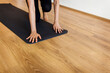 © Valentina Barreto/Stocksy - Cropped woman practicing yoga in studio flooring