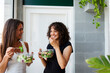 © Valentina Barreto/Stocksy - Young women eating lunch after yoga class