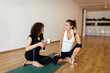 © Valentina Barreto/Stocksy - Friends talking after yoga practice