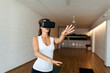 © Valentina Barreto/Stocksy - Fit woman practicing yoga wearing VR glasses