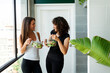 © Valentina Barreto/Stocksy - Mixed women eating lunch after yoga