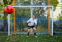 Female Soccer Player Goalkeeper Trains On The Sports Field