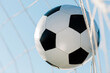 © Alexey Kuzma/Stocksy - soccer ball in closeup, selective focus