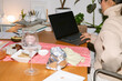 © ByLorena/Stocksy - UGC woman eating while working at night