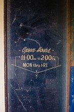 Dusty Old Business Door With Open Hours 11:00-2:00