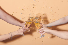 People clinking glasses of champagne at party