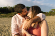 © Studio Serra/Stocksy - Couple Kissing At The Beach