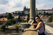 Young woman visiting Prague and its monuments