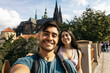 © Pedro Merino/Stocksy - Couple taking a selfie in Prague