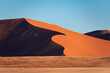 © Elena Saurius & Dani Rex/Stocksy - Detail of a sand dune in Namib desert, with blue and clean sky, Africa