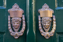 Antique Metal Door Knob. Classic Brass Door Knob On Green Door Vintage Style.