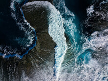 Top Down View Of Ocean Waves Crashing On Reef Coastline 