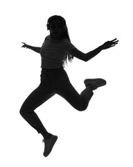 Wall Mural - Silhouette of young woman in headphones jumping on white background