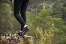 Female Hiker Pauses On A Rock In The Forests Of Zaragoza, Spain