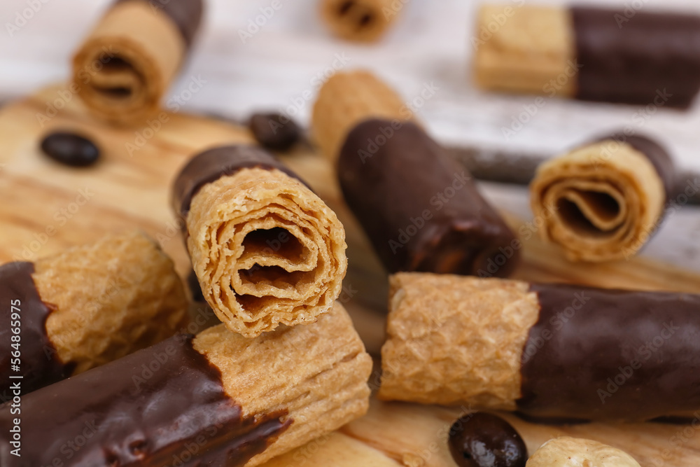 Heap of delicious wafer rolls on table, closeup