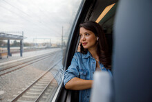 Contemplating Female Passenger Traveling In Train