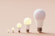 © Davide Illini/Stocksy - Many light bulbs on a pastel background. Concept 3d illustration.