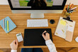 © Valentina Barreto/Stocksy - Female using graphic digital tablet at desk