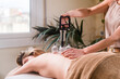 © Ibai Acevedo/Stocksy - Relaxed woman enjoying traditional cupping therapy