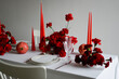 © Nikita Sursin/Stocksy - New year table setting with red dianthus