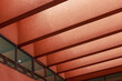 © Jeongho Byeon/Stocksy - Red building structure close-up.