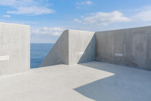 Sunny Sky And Sea Behind The Concrete Structure.