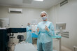 © AD Astra Team/Stocksy - The surgeon and the intern are standing in the operating room