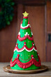 © Ruth Black/Stocksy - Christmas tree cake with buttercream garlands