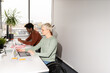© Hernandez & Sorokina/Stocksy - Busy Workers At Office Desk
