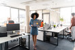 © Hernandez & Sorokina/Stocksy - Candid Photo Of Office Workers